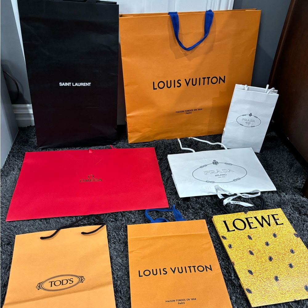 Shopping bags louis vuitton, prada, omega, tods, loewe, saint laurent